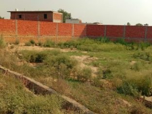 plot 30 metre from 60 feet broad main road in a very low budget